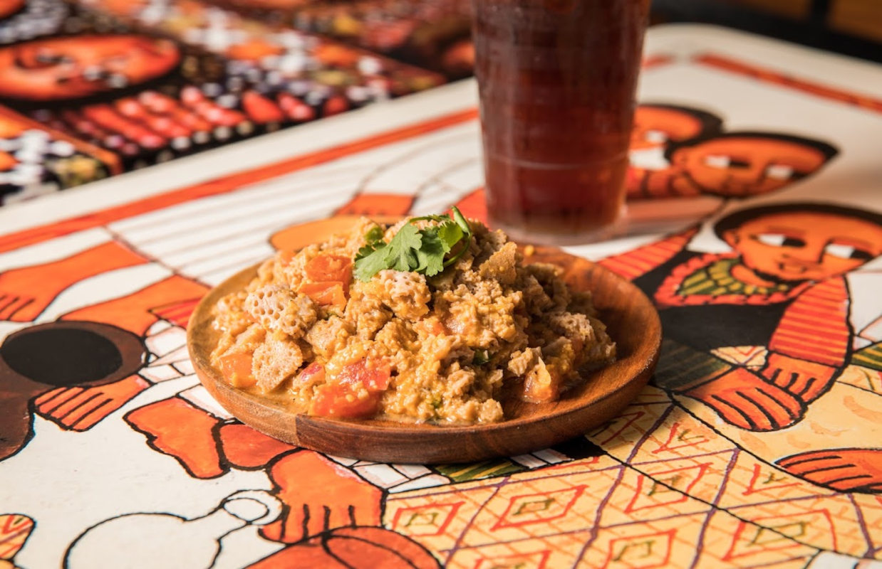 Shredded injera mixed with chickpeas, fresh diced tomatoes, red onion and jalapeño